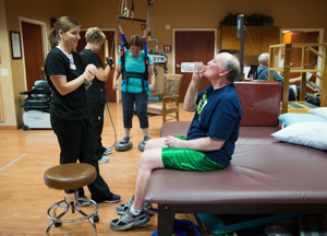 Jim Horrocks takes a break from his Parkinson's disease-focused rehab therapy with physical therapist Christine Montes