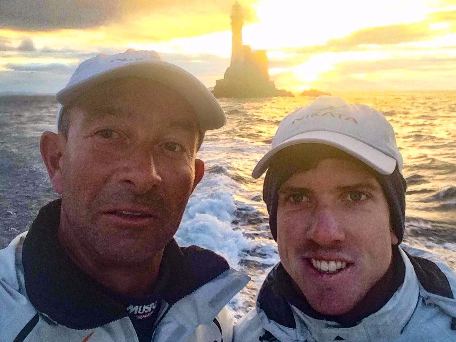 America's Cup winning helmsman Peter Burling (right) with Ian Budgen at Fastnet Rock on board 115 foot Nikata