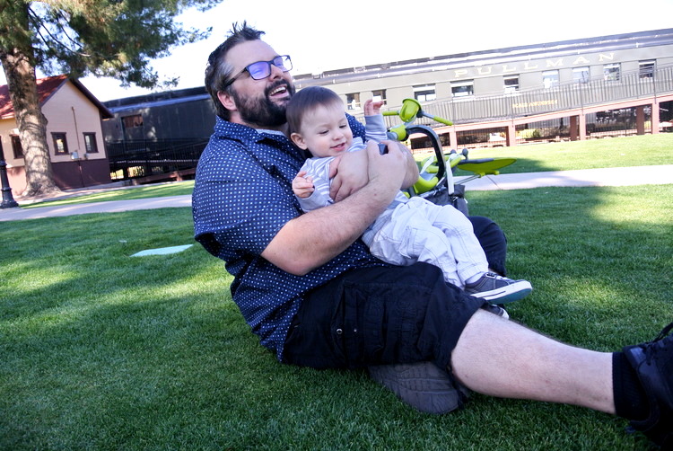 Baby CJ and Husband railroad park, park, local, az, scottsdale, phoenix, arizona, outdoor, outside, amusement, rides, toddler, kids, fun, venture, adventure, spring, family, baby, parenthood, motherhood, fatherhood, parents, play, train, model, learn, carousel, snack bar, affordable, cheap, museum, mccormick stillman, gift shop, attraction, trains, playground