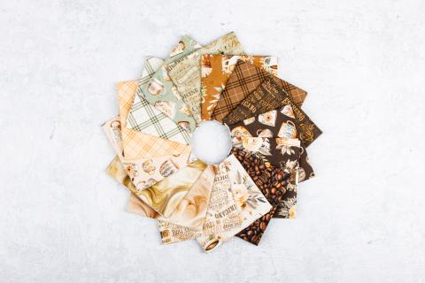 Coffee Time fabric fan in cream, shell, brown, and cinnamon