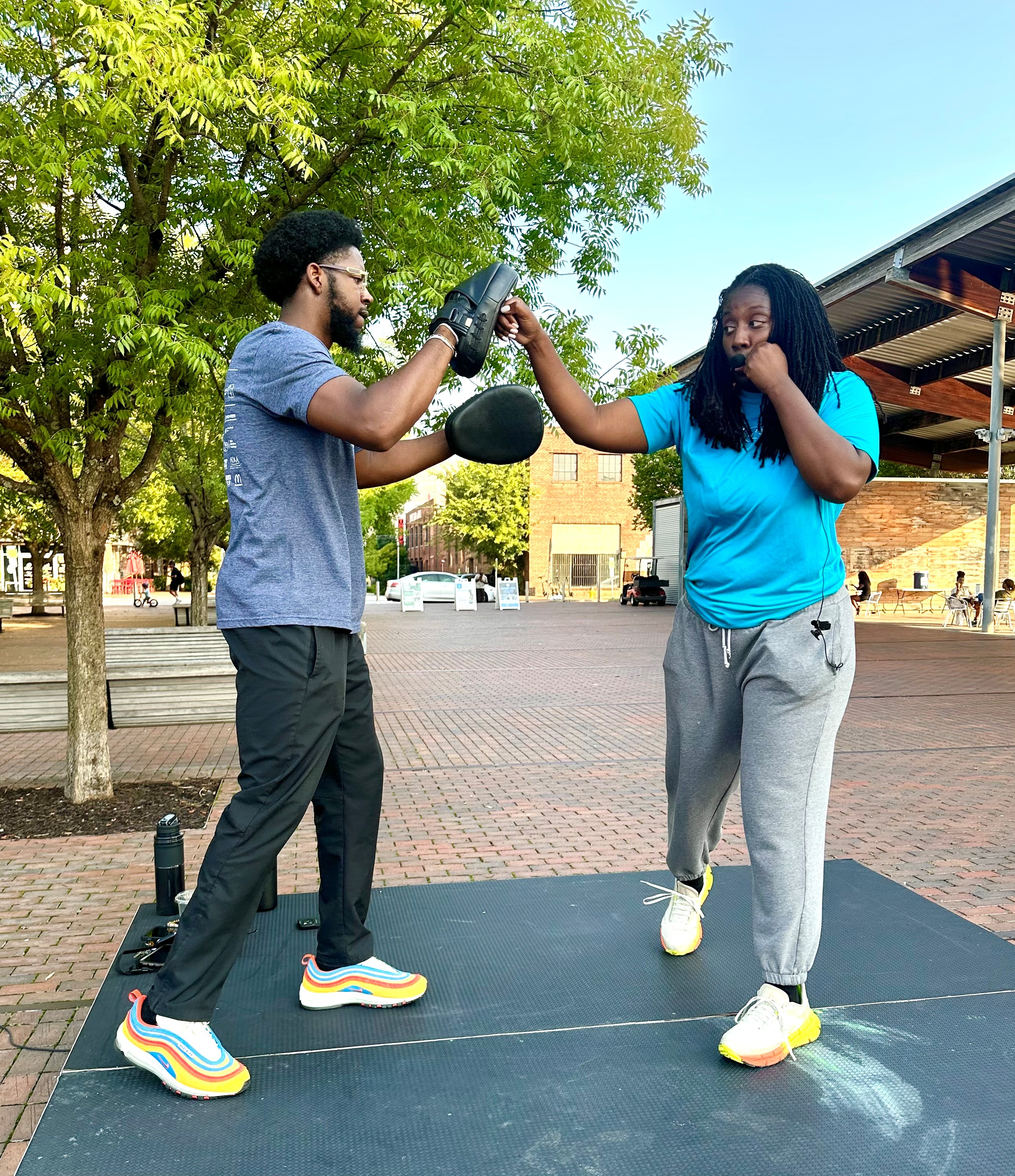 Coko Eason leads a free boxing fitness class at Railroad Park on Mondays at 6 p.m. Attendees said they've lost weight and improved mobility, thanks to her instruction. (Photo by Chanda Temple)