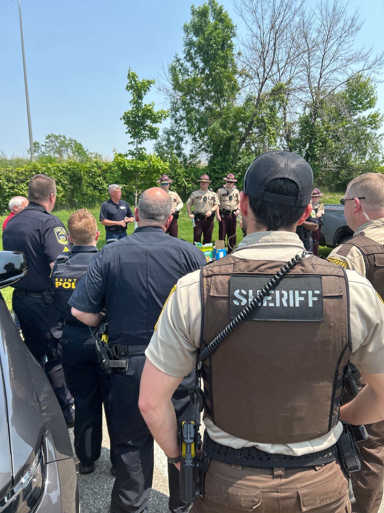law enforcement officers standing around planning an extra speed enforcement event.