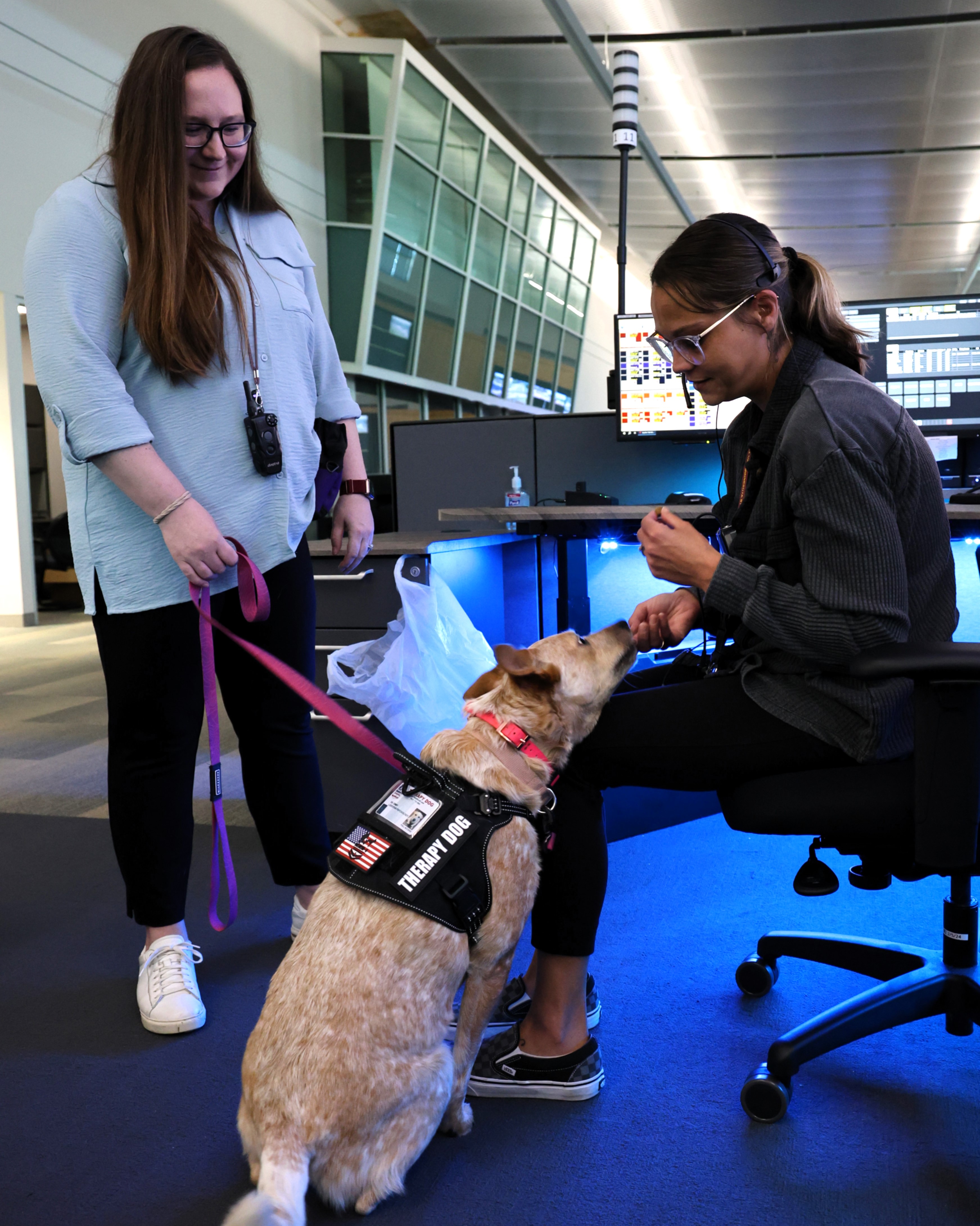 Dr. Amy Schweigert visits with a State Patrol Dispatcher.