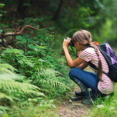 young girl looking for wildlife