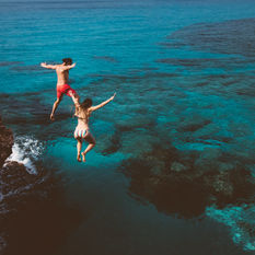 People Jumping Off a Cliff