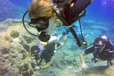 young girl scuba diving