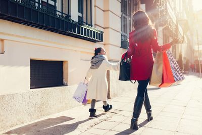 a mother and young daughter shopping