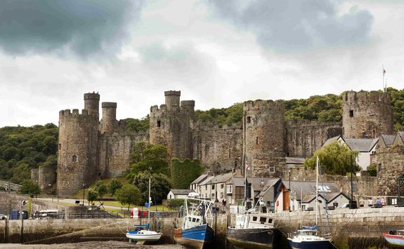 Conwy Castle with harbour in the foreground