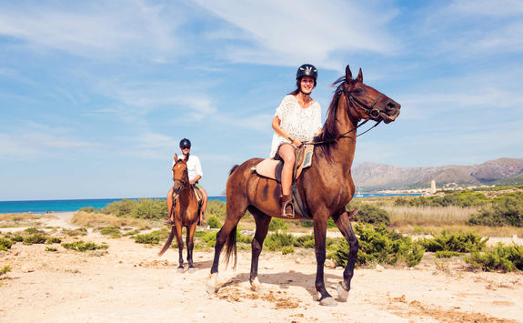 Couple horseback riding