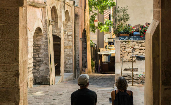 Couple in an old street of Bonifacio