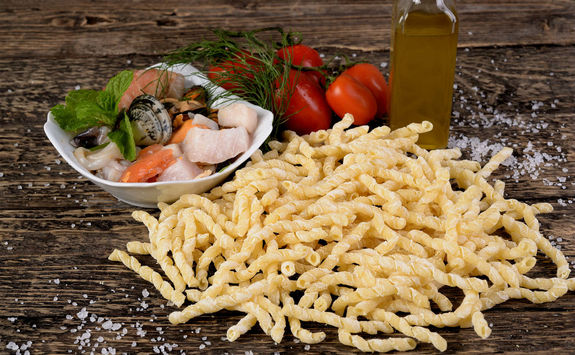 raw busiate with fish dressing