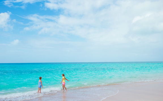 Girls playing on a beach in Antigua