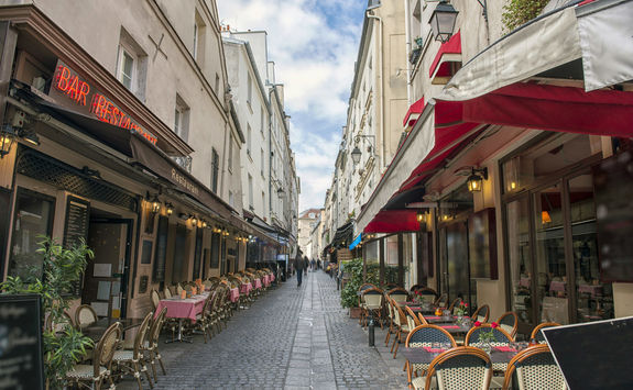 Empty dining tables and chairs in Paris