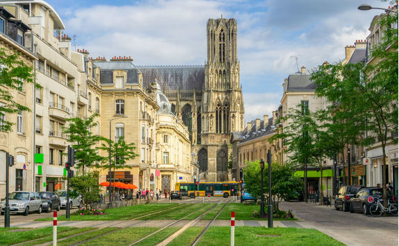 Tram on the streets and architecture of Reims