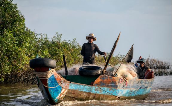 two fishermen on the fishing boat