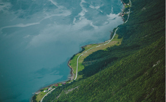 Curvy road by fjord in Norway