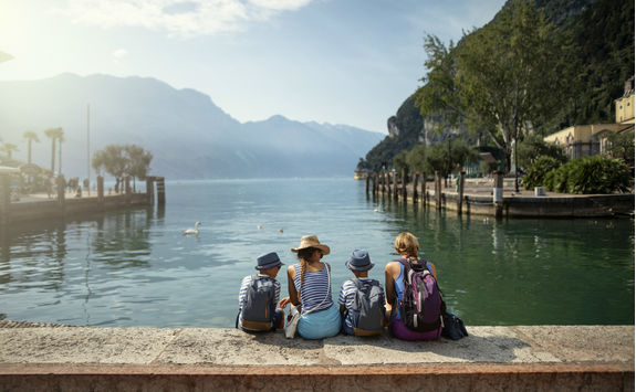 Family sitting enjoying view of lake Garda