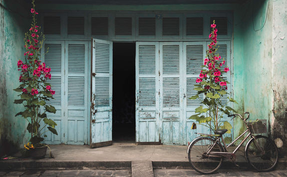 Wooden house with bike in Hoi An