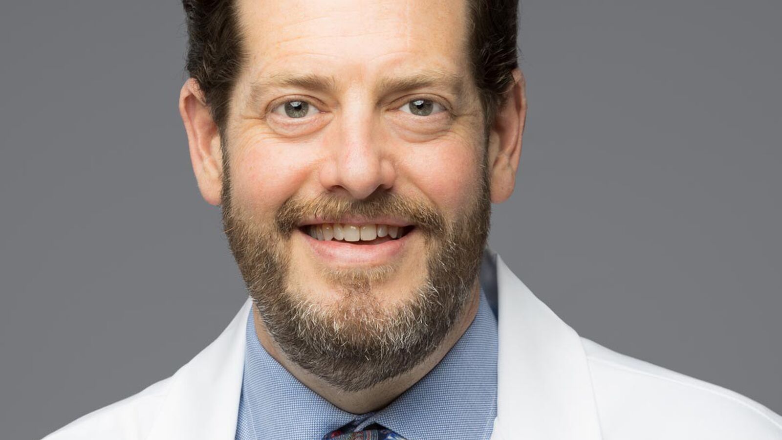 Adam Arthur headshot 2023 whitecoat
