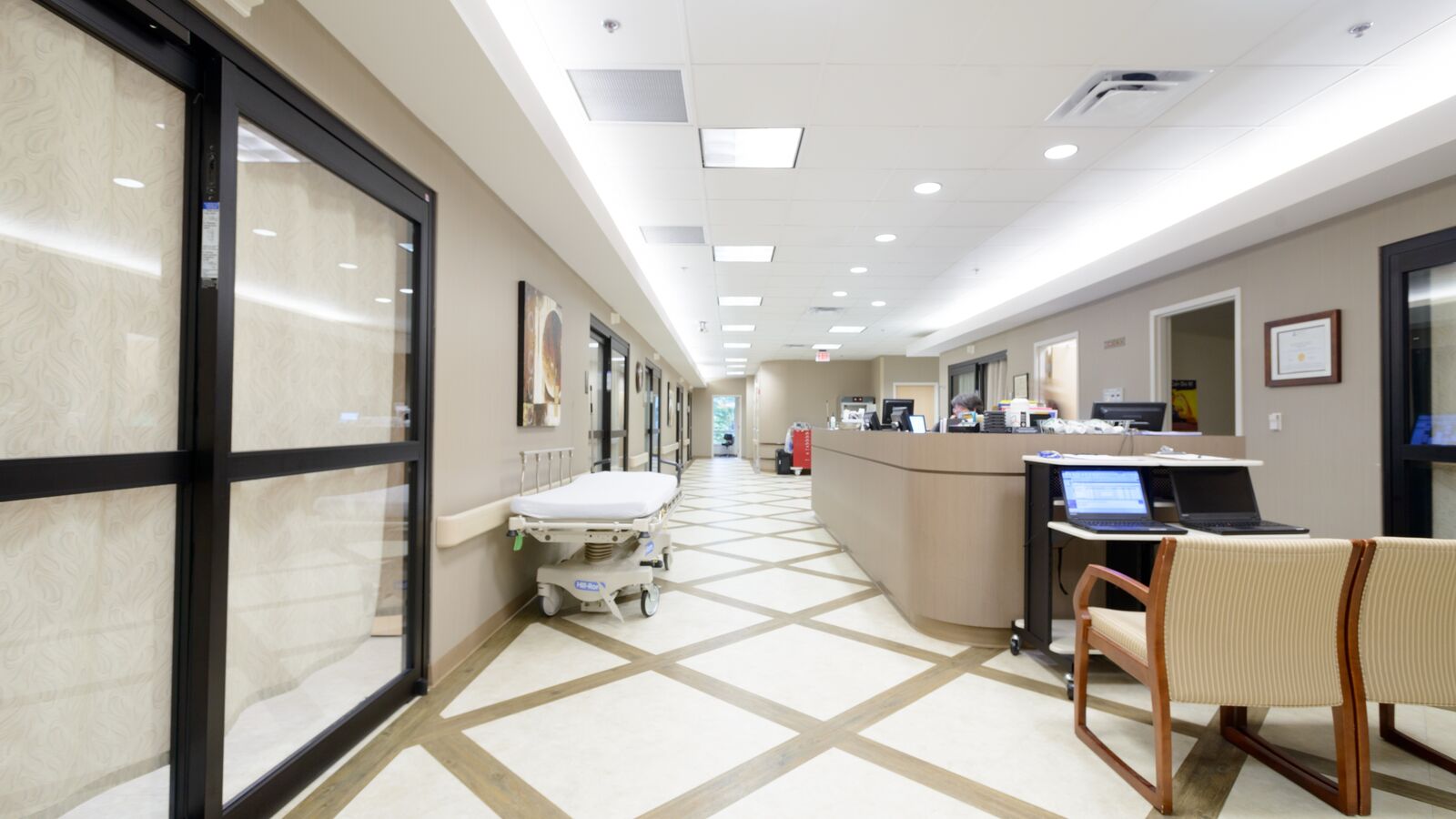 Interior of the surgery center, with a check in desk and chairs