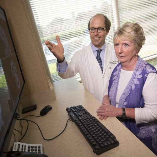 Dr. Madison with an older female patient at Semmes Murphey