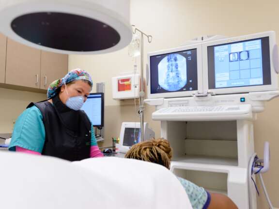 Nurse with Patient Before a Pain Block - Semmes Murphey Clinic