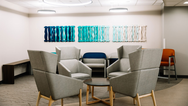 The waiting area offers comfortable seating in a bright, clean and modern space.