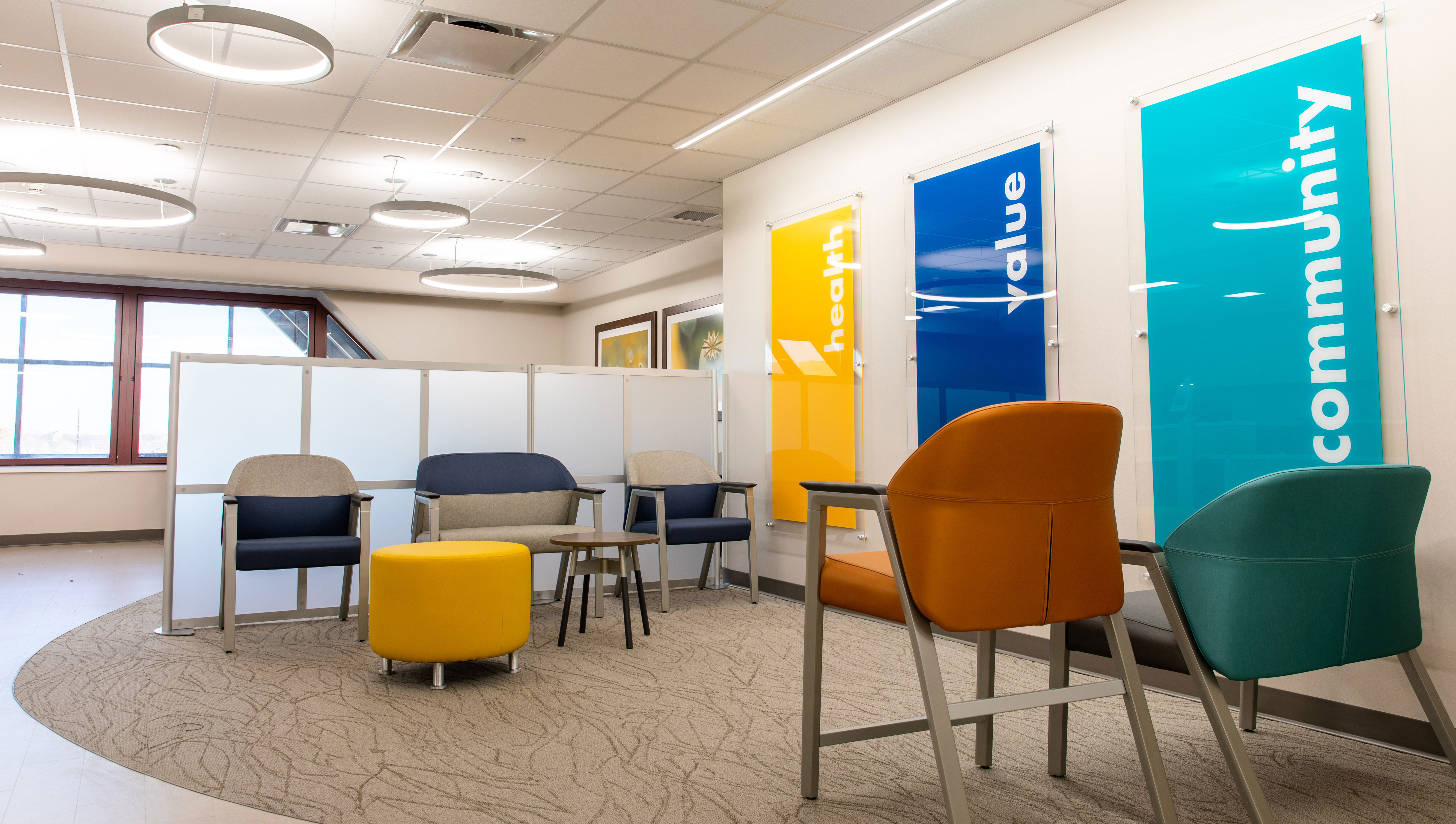 The waiting area offers comfortable seating in a bright, clean and modern space.