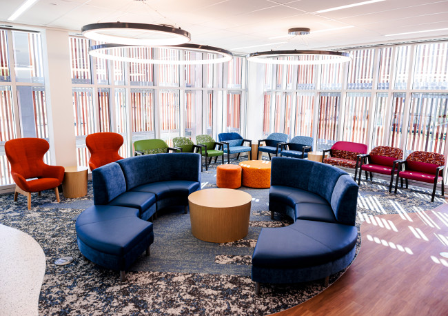 The location includes 60 brightly colored exam rooms and vibrant waiting spaces for patients.