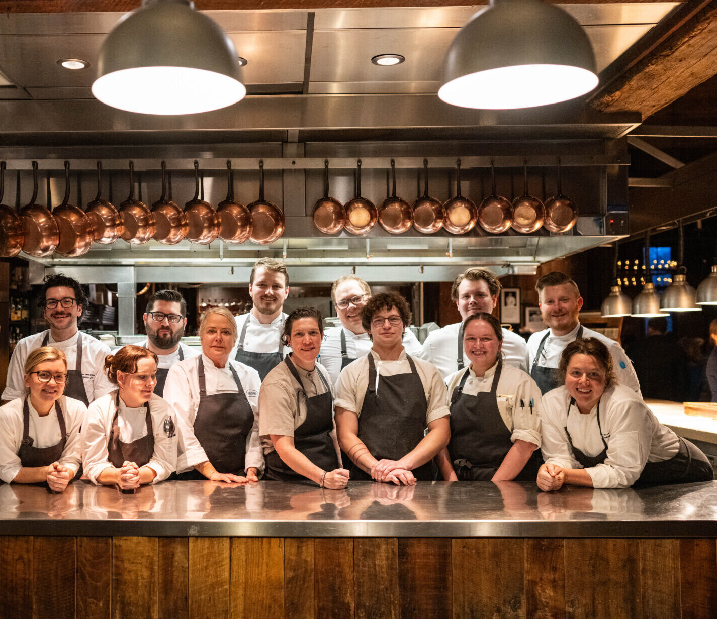 Staff of Blackberry in a group pose in The Barn kitchen