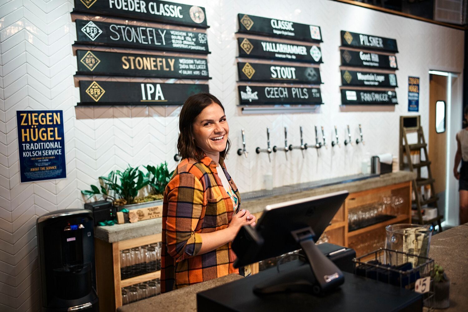 Taproom Bartender behind the register