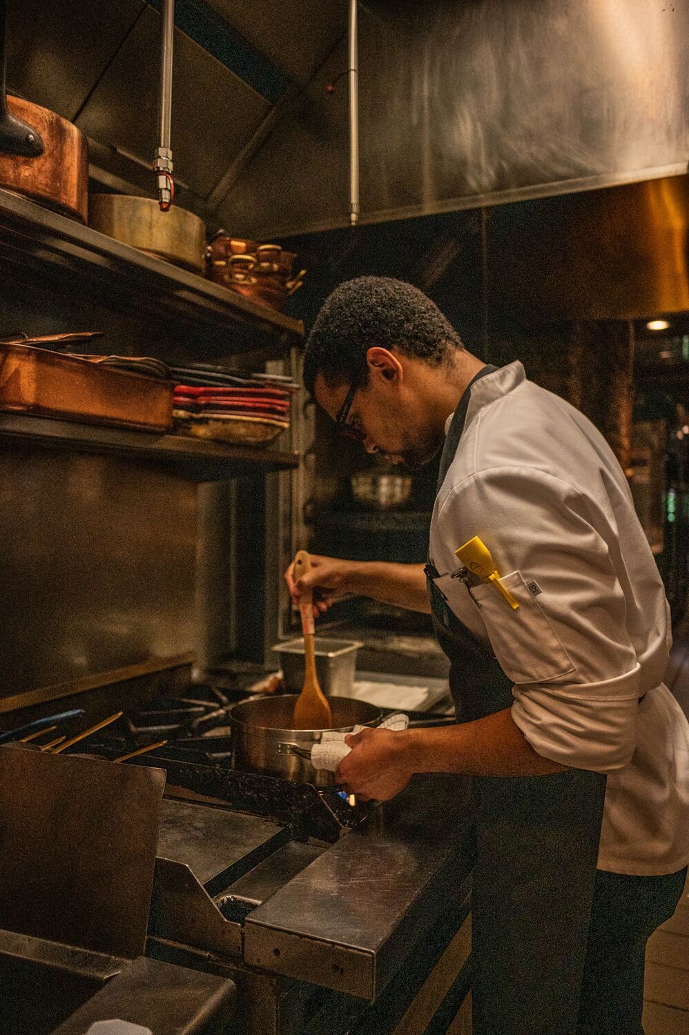 Cook working on the flattop