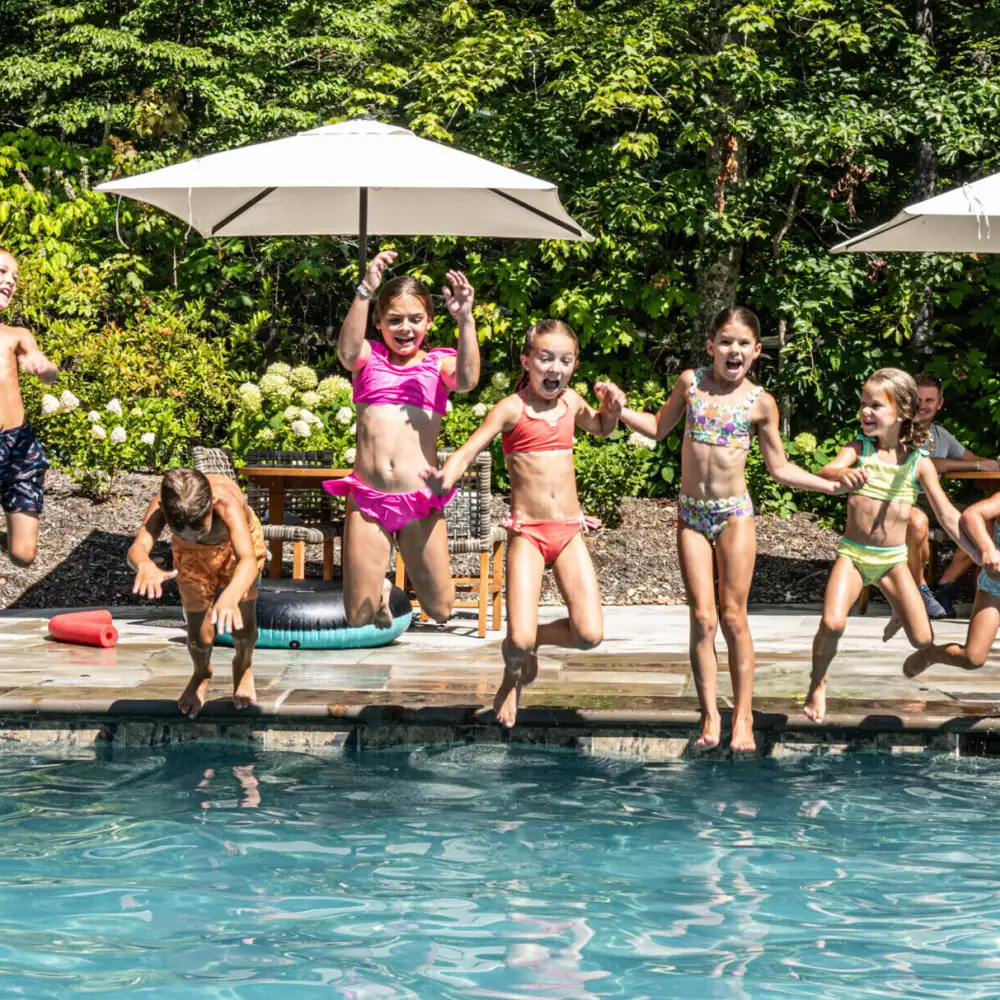 Group of Kids Jumping in Pool