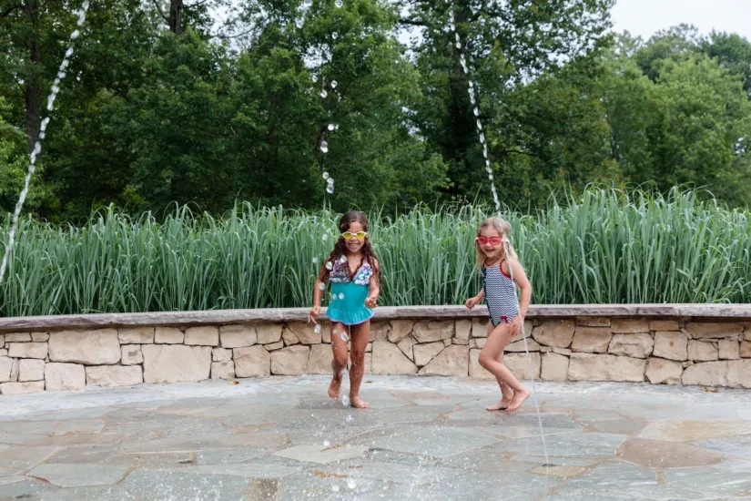 Children Playing in Water at the Family Pool