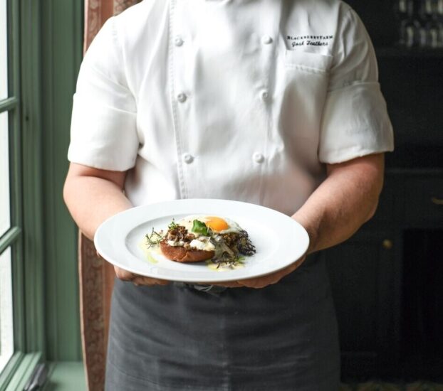 Chef Josh Feathers Holding Dish