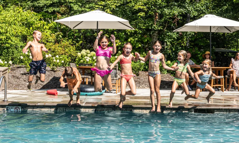 Group of Kids Jumping in Pool