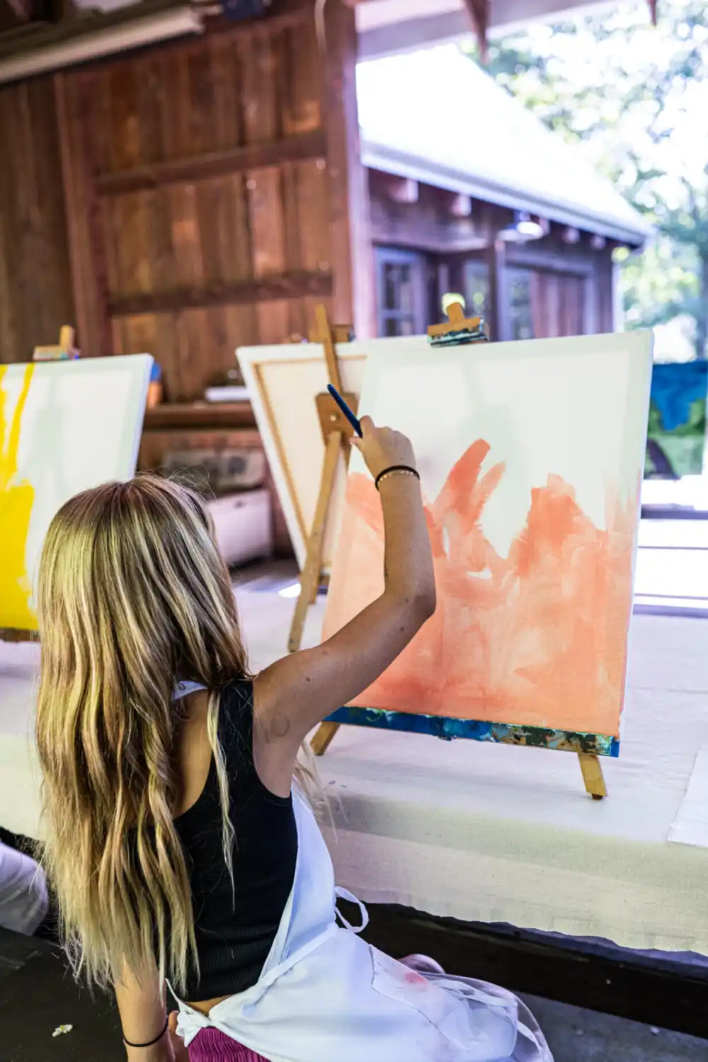 Girl Painting a Canvas