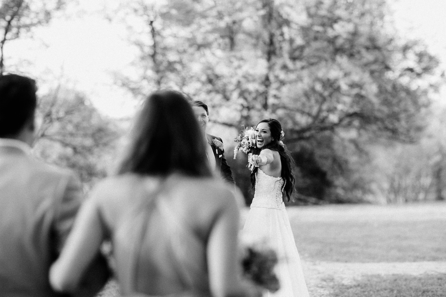 bride and groom celebrating with bridal party 