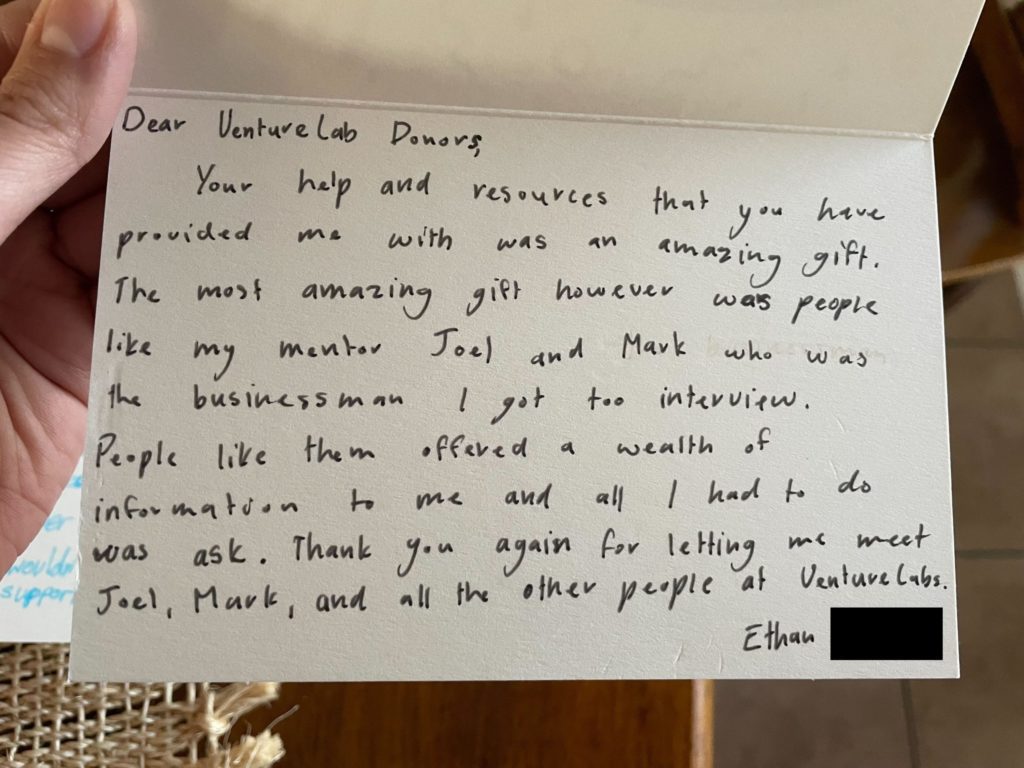 A handwritten thank-you note on white card stock expressing gratitude for help and resources, specifically mentioning mentors Joel and Mark, and thanking the VentureLab for their guidance in youth entrepreneurship education. Signed, "Ethan".