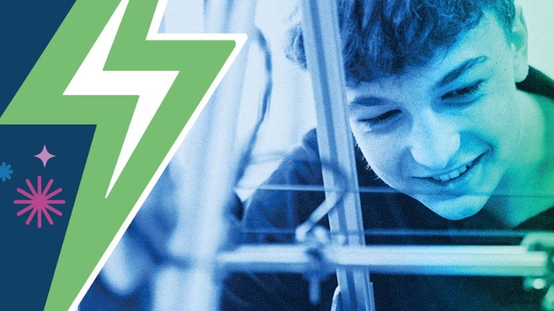 Male Student Creating Prototype with Mott Million Dollar Challenge Logo lightning bolt