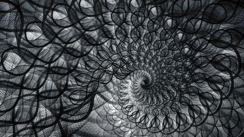 Abstract spiral pattern symbolizing financial flow and recurring transactions, representing the cyclical nature of budgeting in a calendar system.