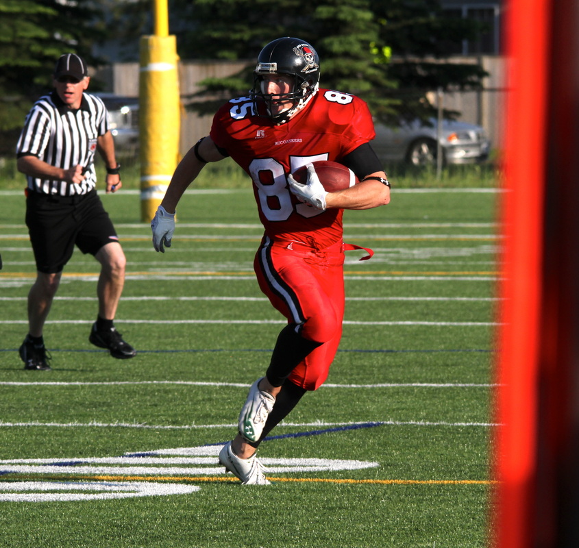 Matt Merkely carries the ball down field