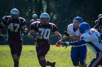 Runningback #70 Carson Reid evades defenders in the Falcons' Thursday win.
