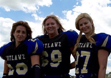 (Left to right) Proud moms and football players Sherri Toews, Jodie Ward and Barr don the Outlawz jersey. (Image obtained from Facebook)