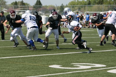 Rylee Nepinak carries the football