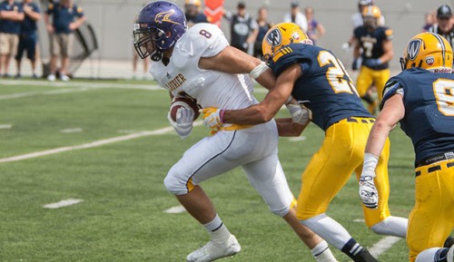 Hawks receiver Anthony Pizzuti fights through a tackles against Windsor last season (Photo Credit: Heather Davidson)