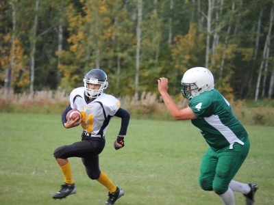 Green Lake #4 Jarod Arnault pursuing #81 Pinehouse Laker Linden Daigneault
