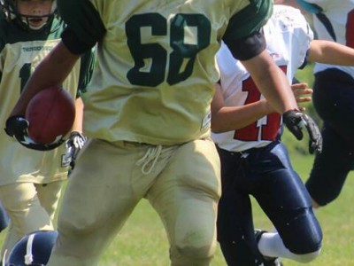 Corey Griffin holds the football. Courtesy of Pamela Malcolm.