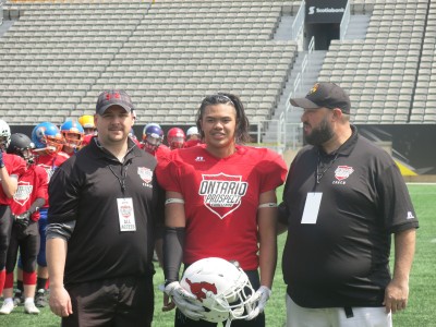 Josh Munoz (#30) with Gary Gerard (left) and Shawn McIntyre (right).