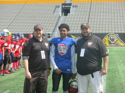 Israel Braithwaite (#28) with Gary Gerard (left) and Shawn McIntyre (right). 